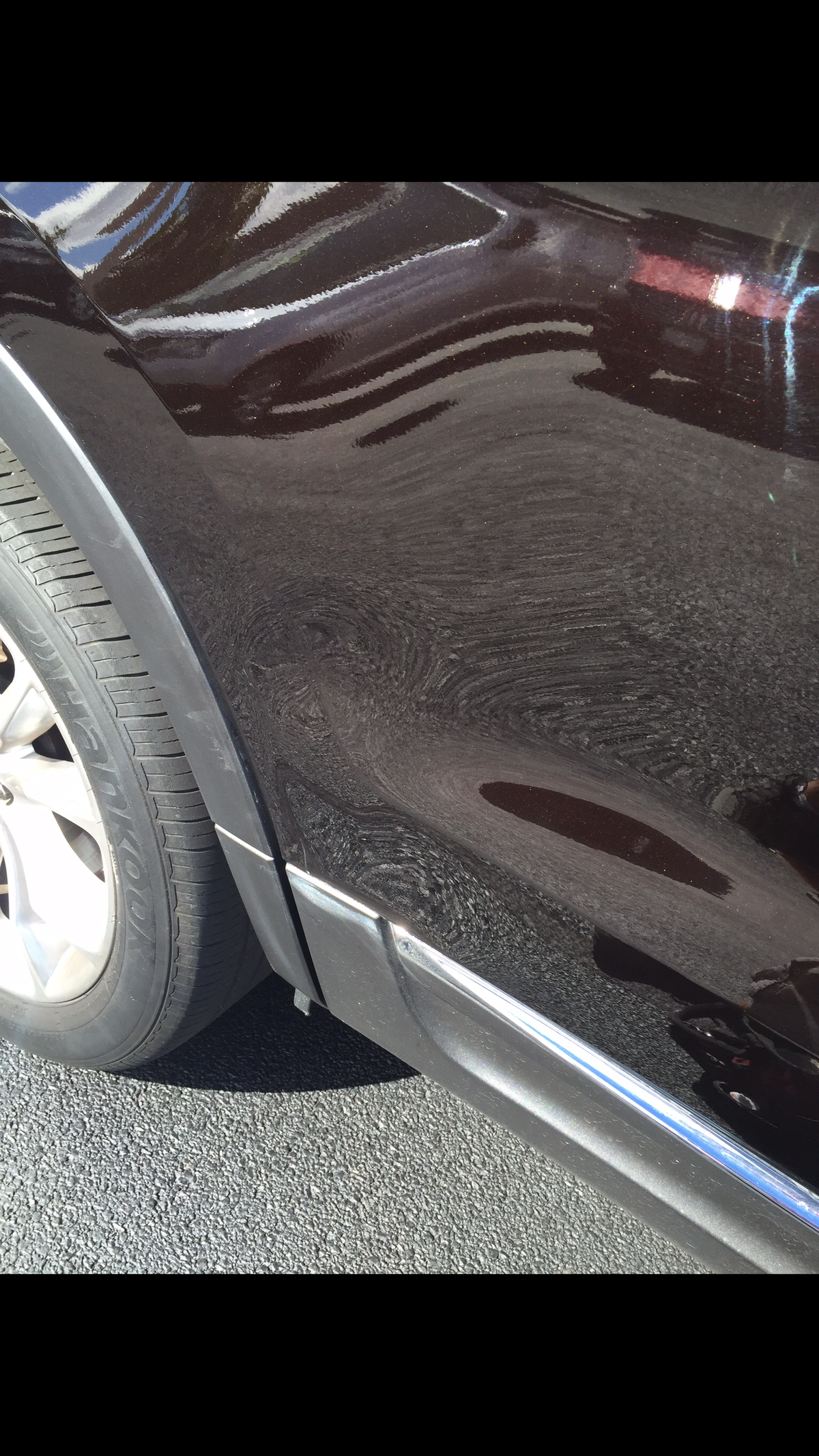 After repair on black vehicle quarter panel with cleaner finish