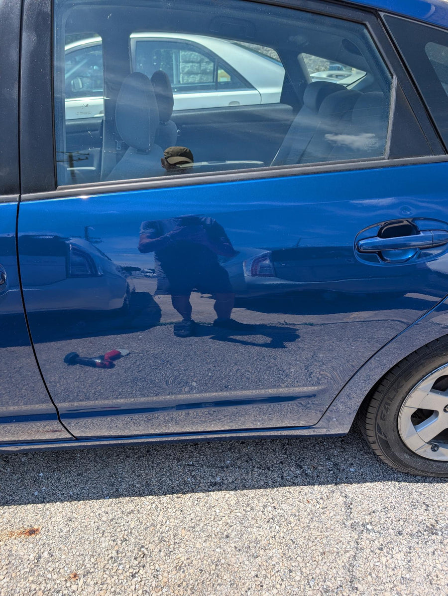 Blue Prius side panel after door scuff repair
