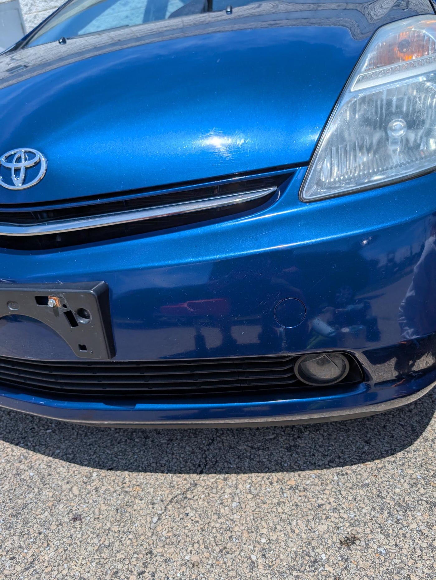 After paint chip cleanup on blue Prius front bumper and hood
