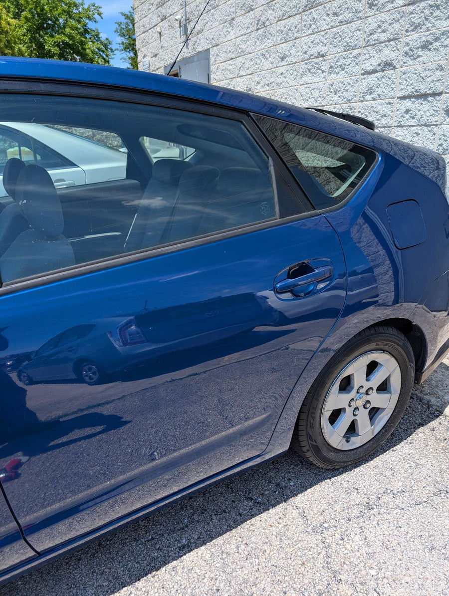 Finished blue Prius side panel after repair work